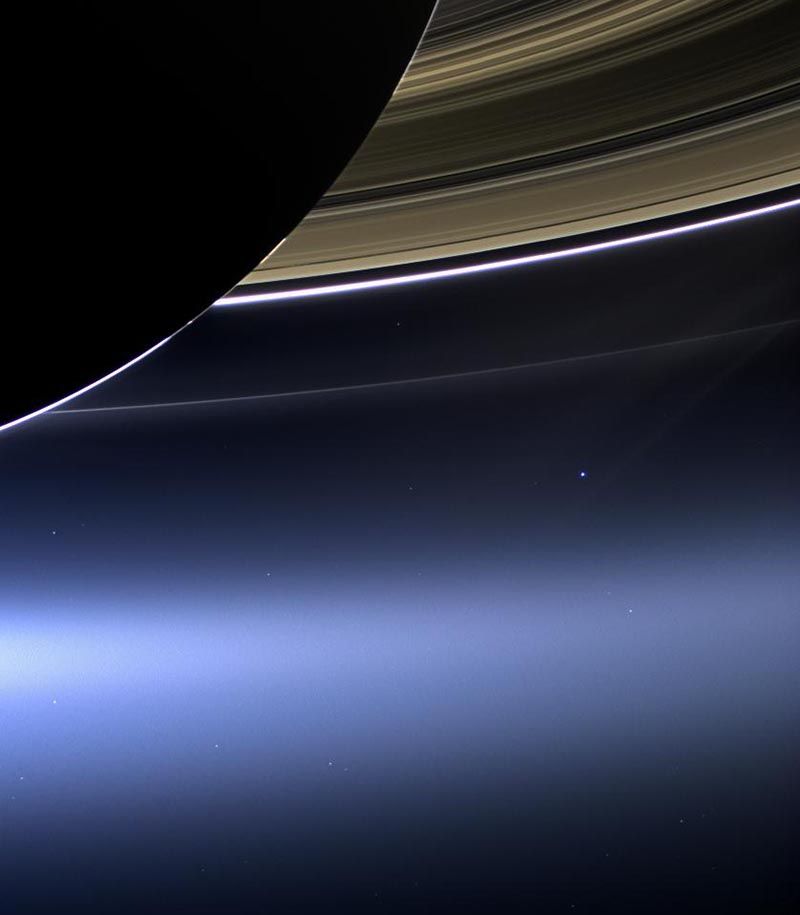 Part of the planet Saturn is partially, with space in the background.